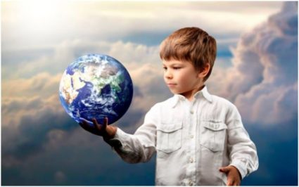 Ребёнок держит в руке земной шар (фотомонтаж)